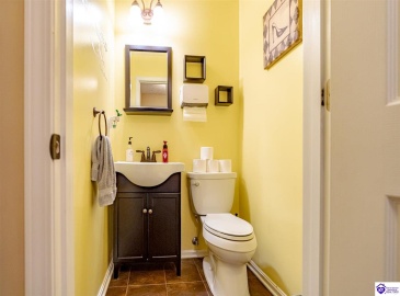 located just off of the kitchen and by the garage entrance