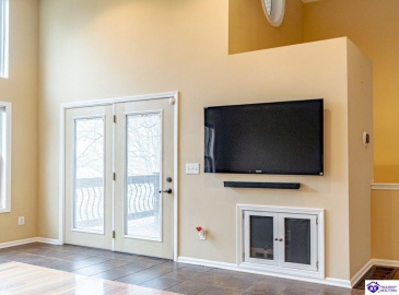 french doors allow access to the covered deck